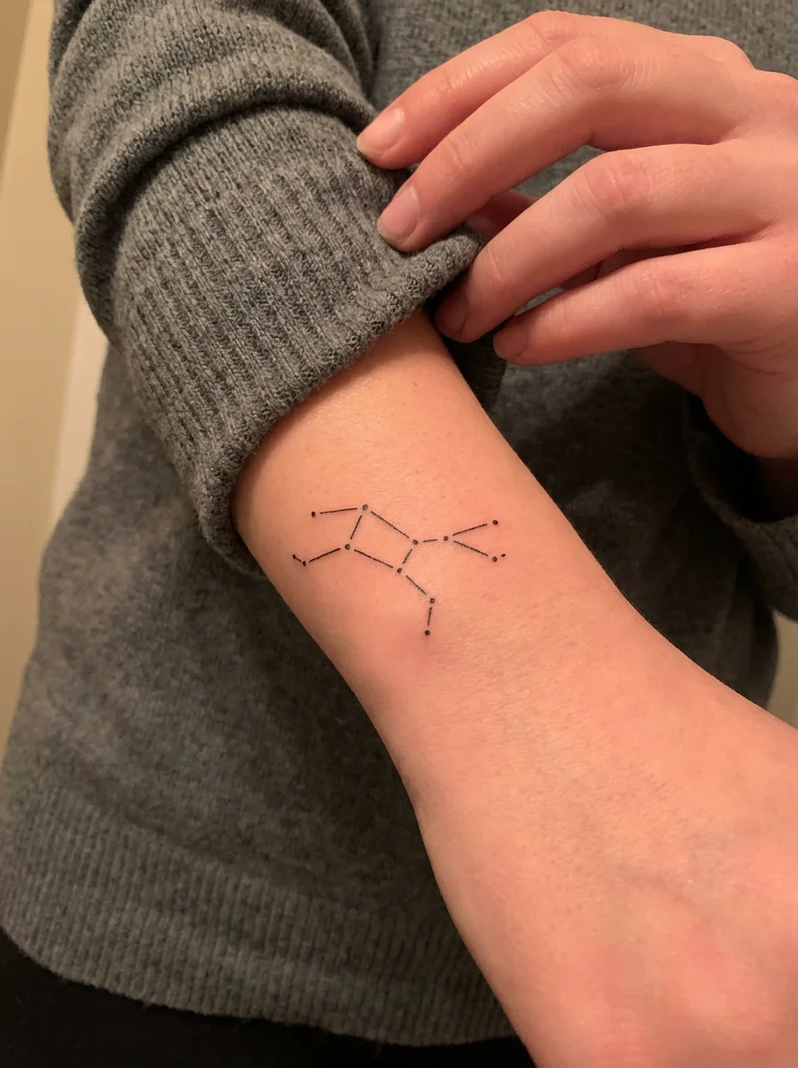 woman constellation zodiac inner arm tattoo