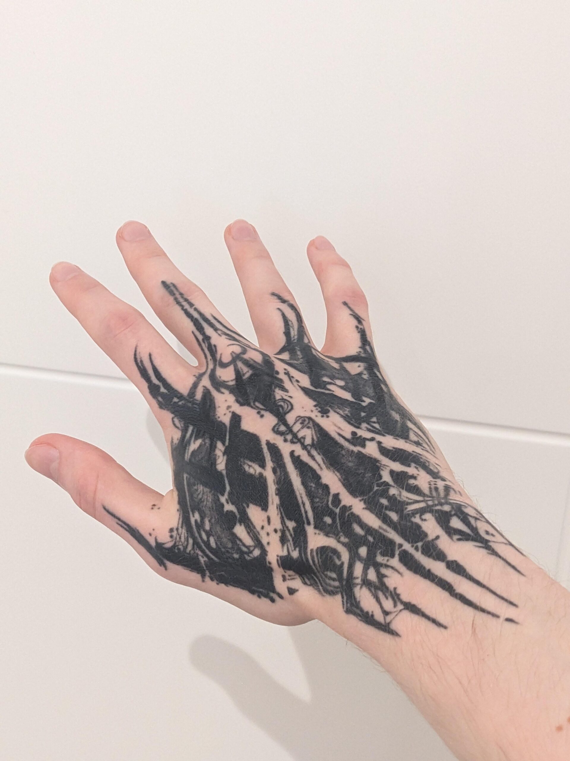 Bold neo-tribal hand tattoo concept