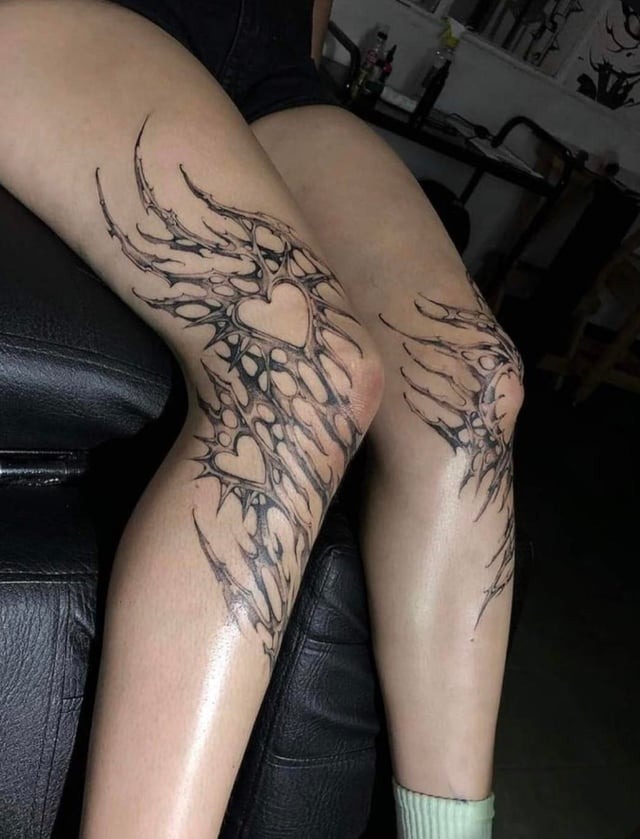 Dainty Heart-Infused Neo-Tribal Leg Tattoos