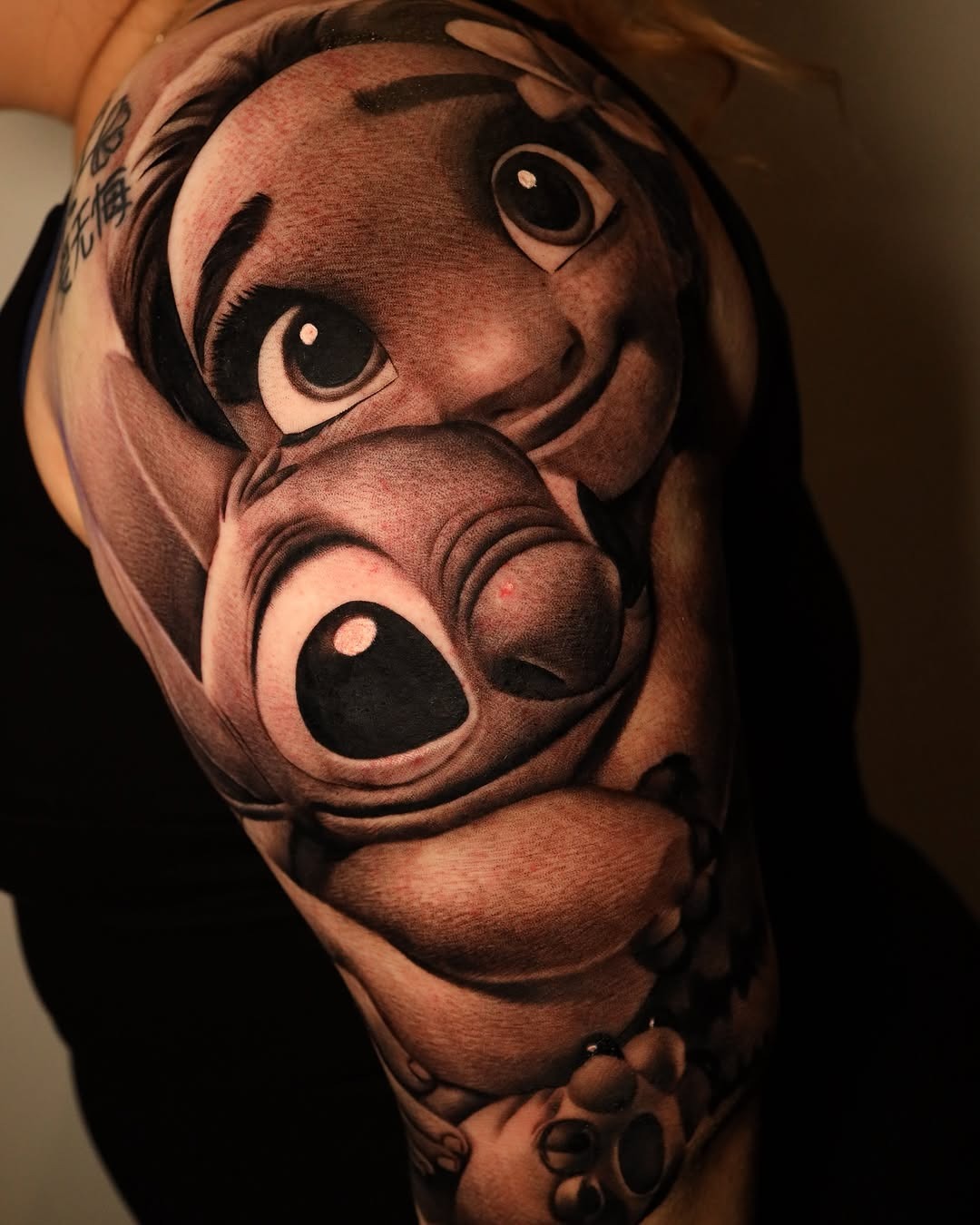 Stunning realistic Stitch portrait tattoo