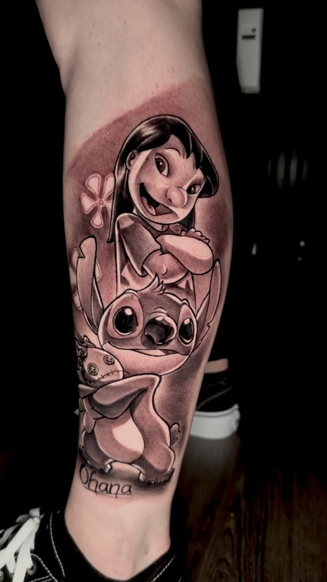 Detailed Lilo and Stitch calf tattoo