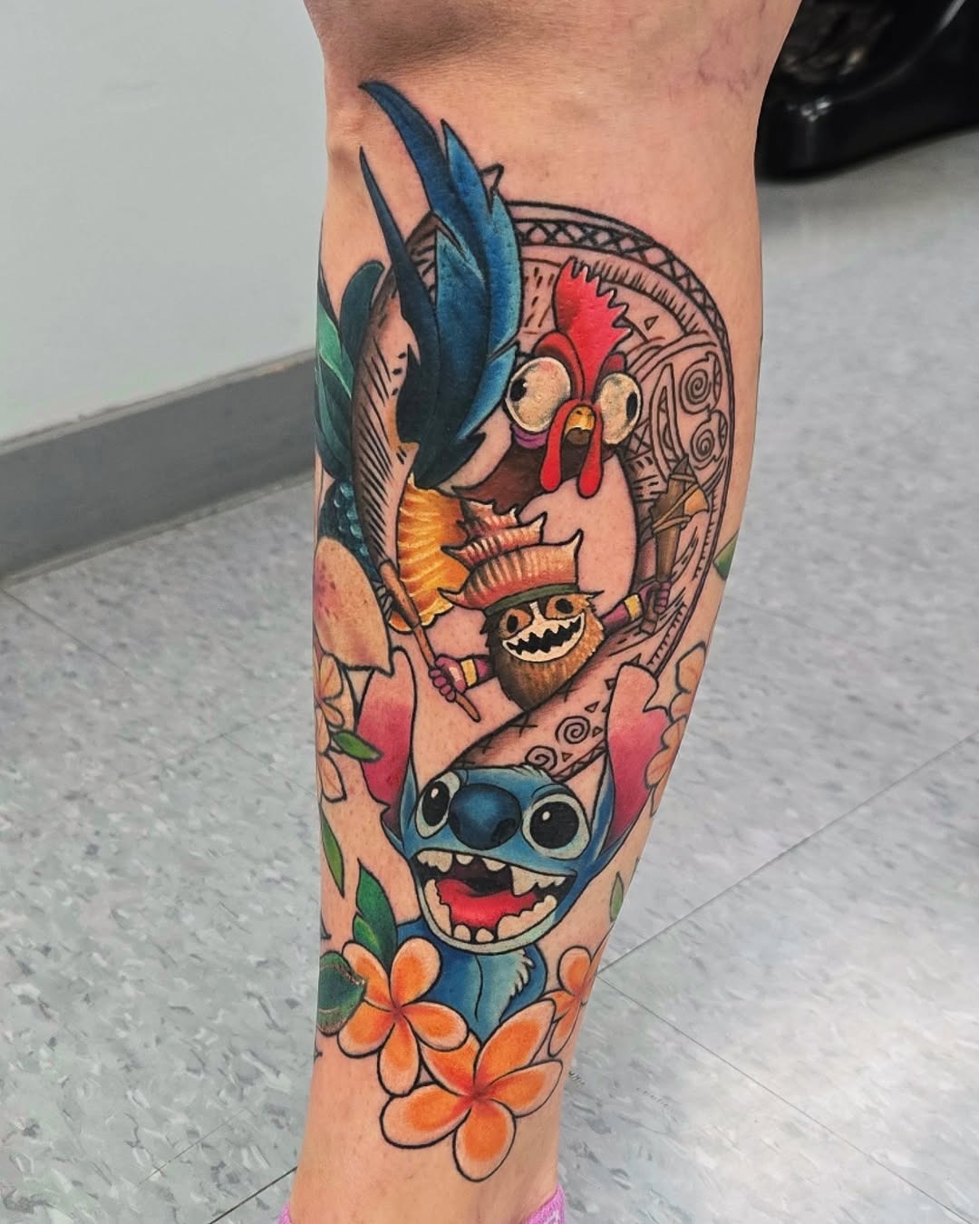 Vibrant Disney inspired sleeve tattoo