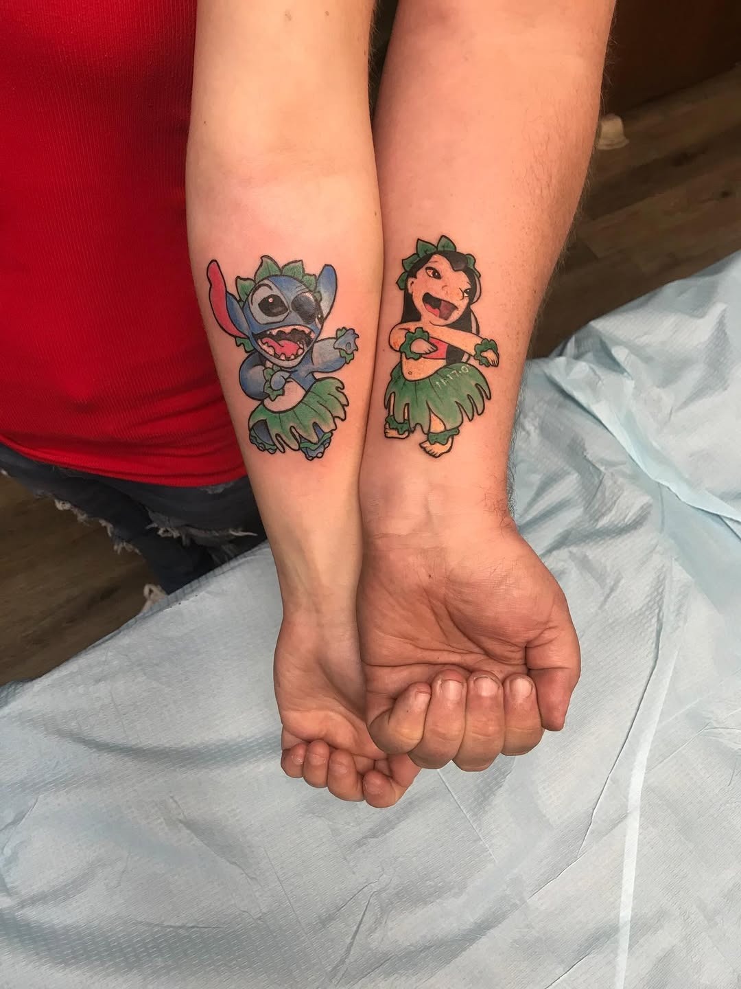 Matching bestie Stitch and Lilo tattoos