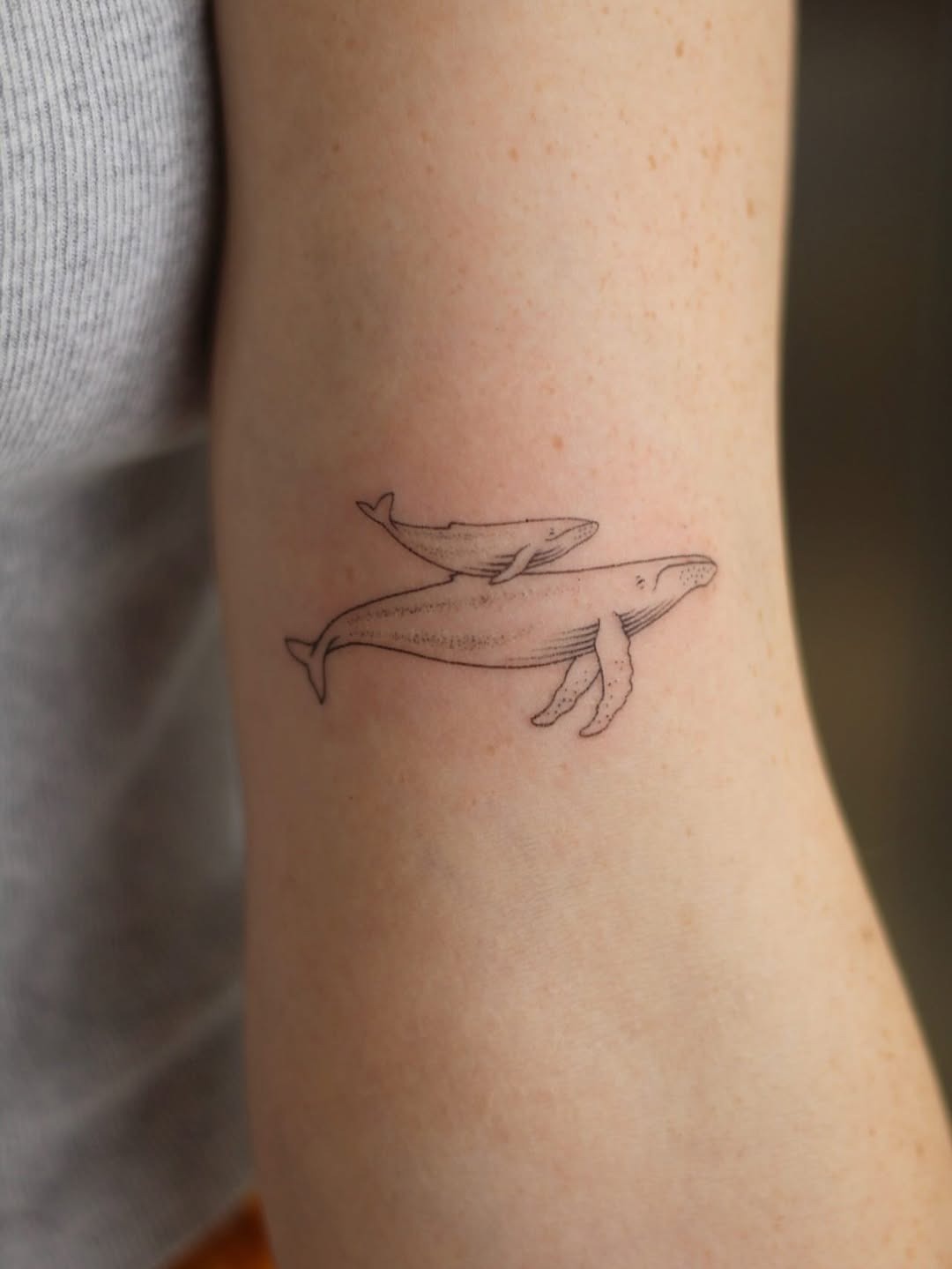 Delicate Fine-Line Whale Tattoo