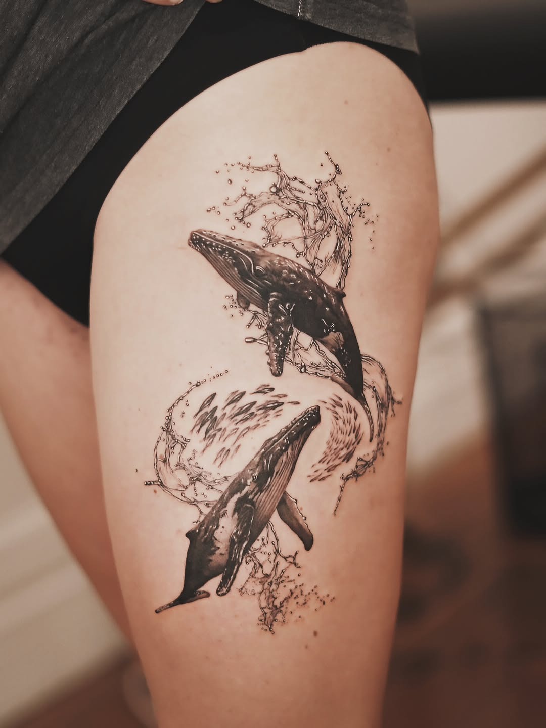Dynamic Artistic Whale Tattoo