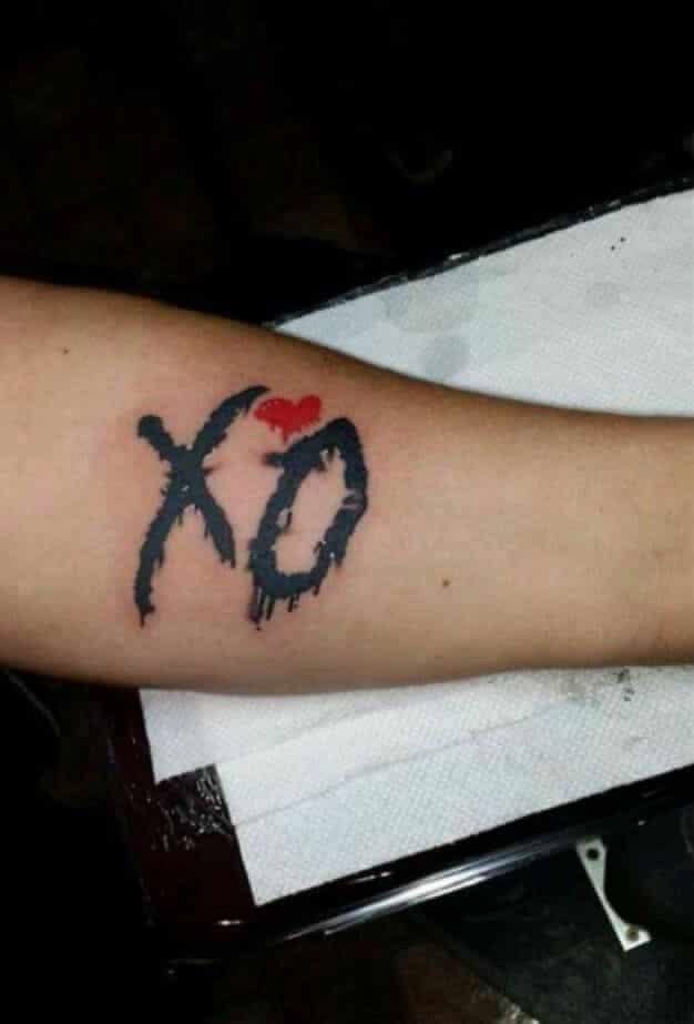 Classic XO Logo Arm Tattoo