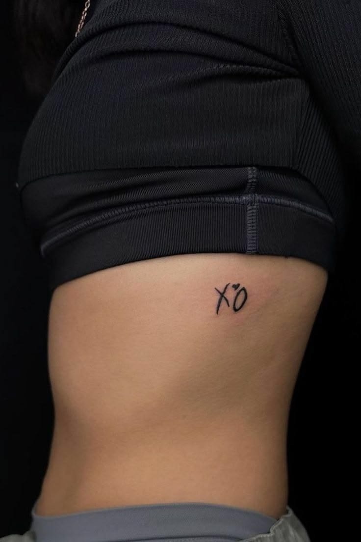 Subtle Rib XO Tattoo Design