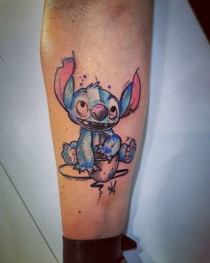 Whimsical Watercolor Stitch Tattoo