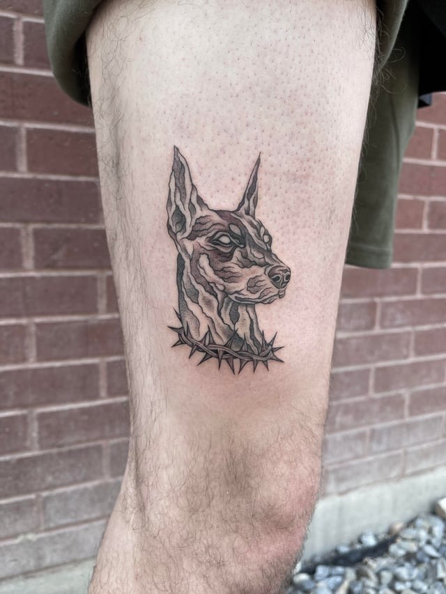 Minimalist Doberman collar tattoo design