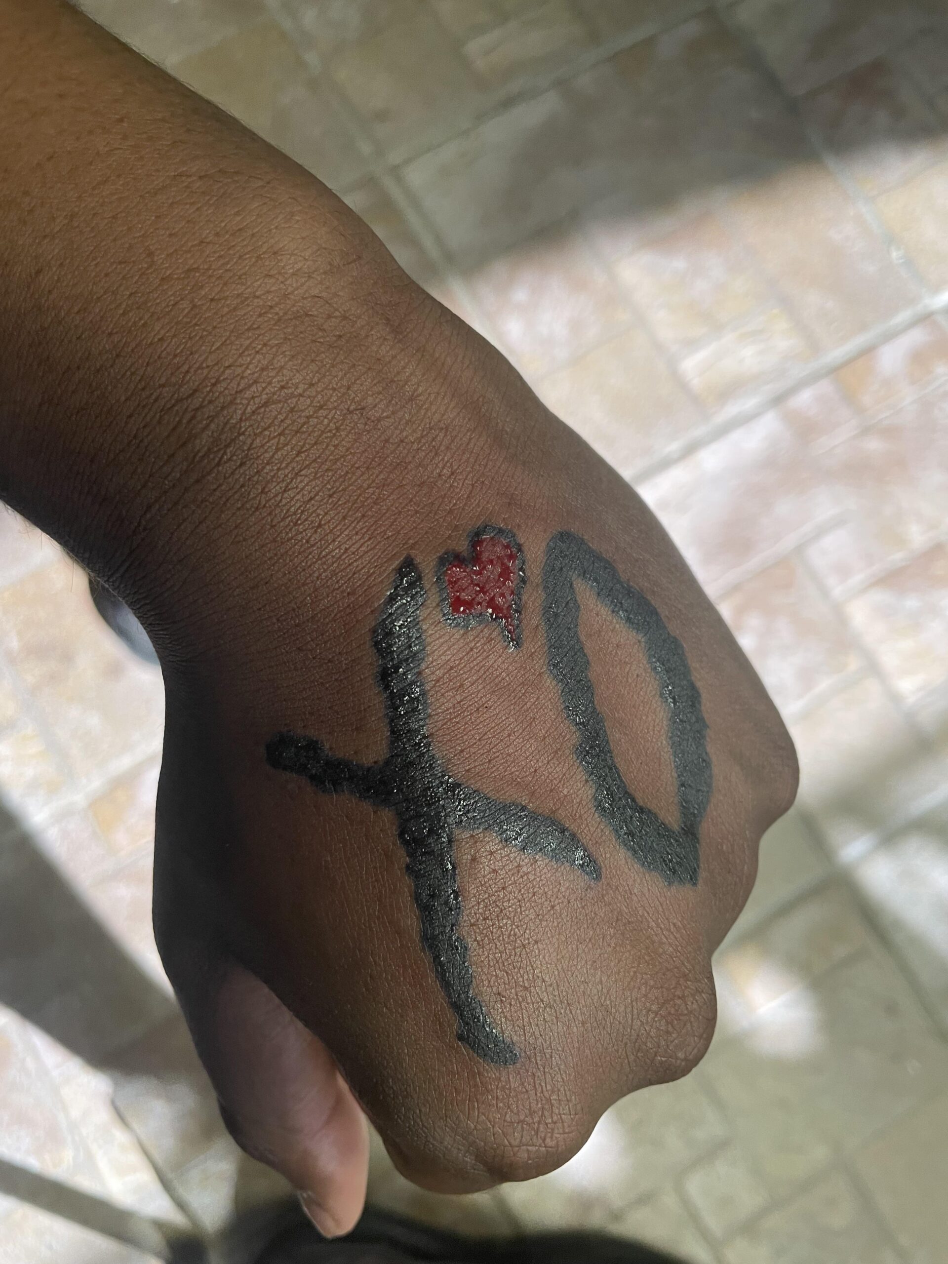 Hand-Placed XO Script Tattoo
