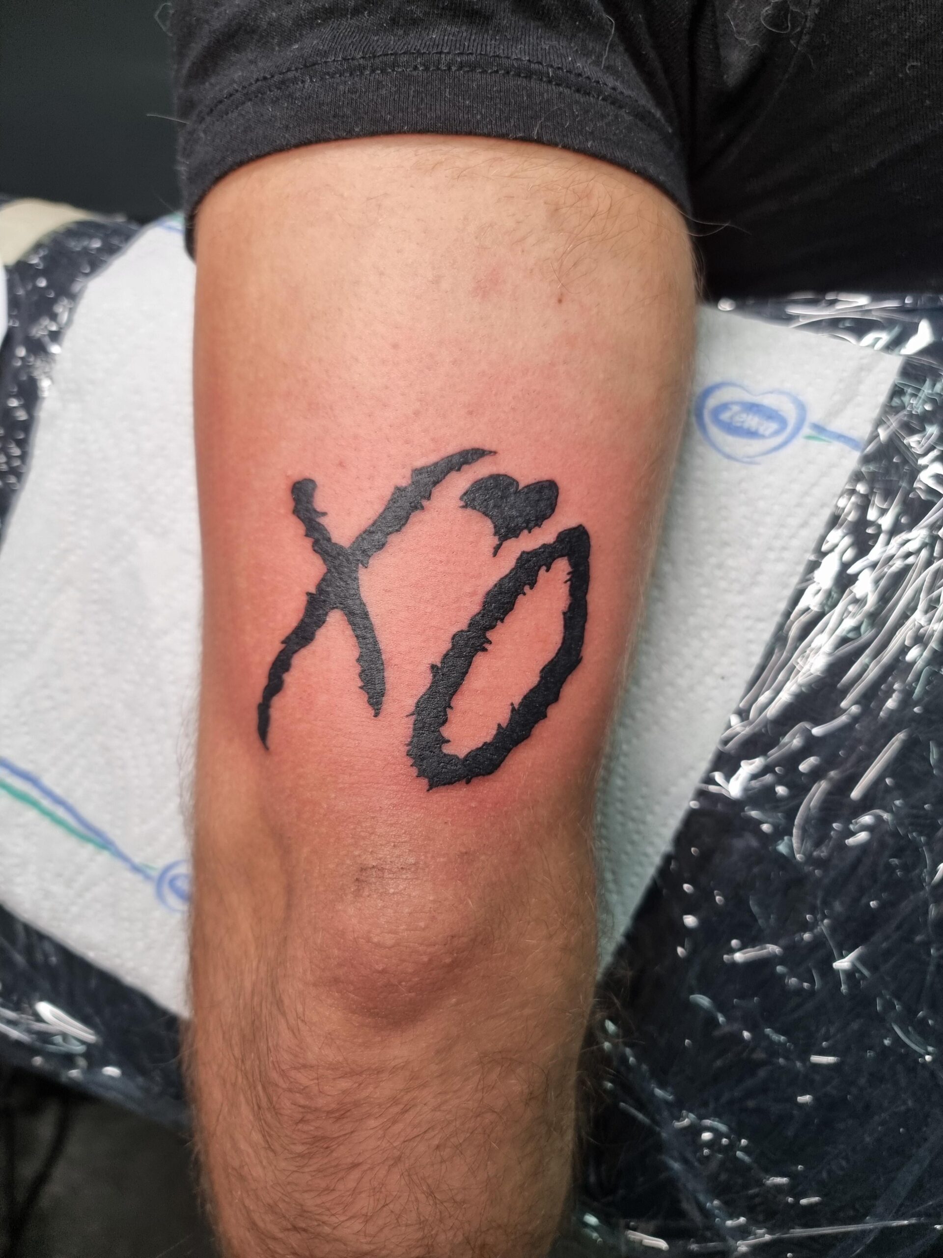 Classic XO Logo Arm Tattoo