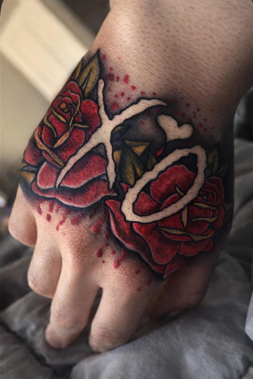 Floral XO Hand Tattoo