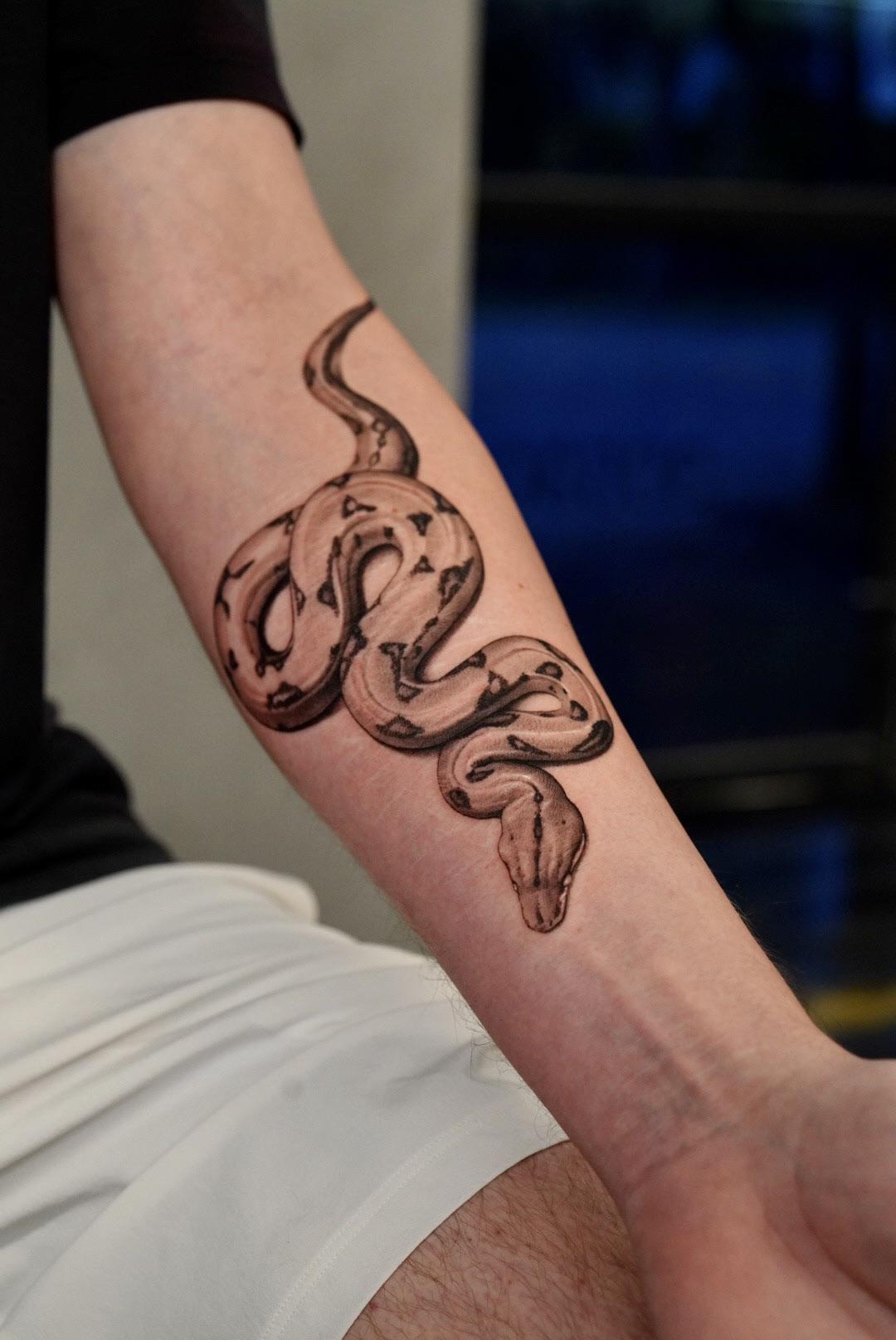 Minimalist Cobra Forearm Tattoo