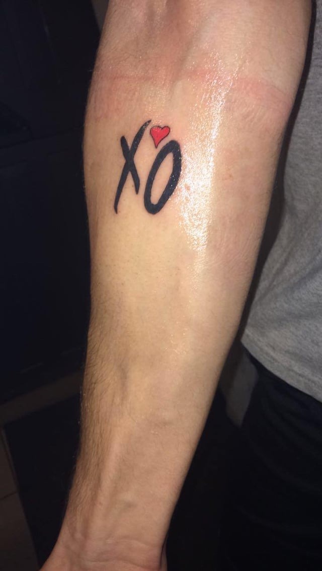 Minimalist XO Forearm Tattoo Design