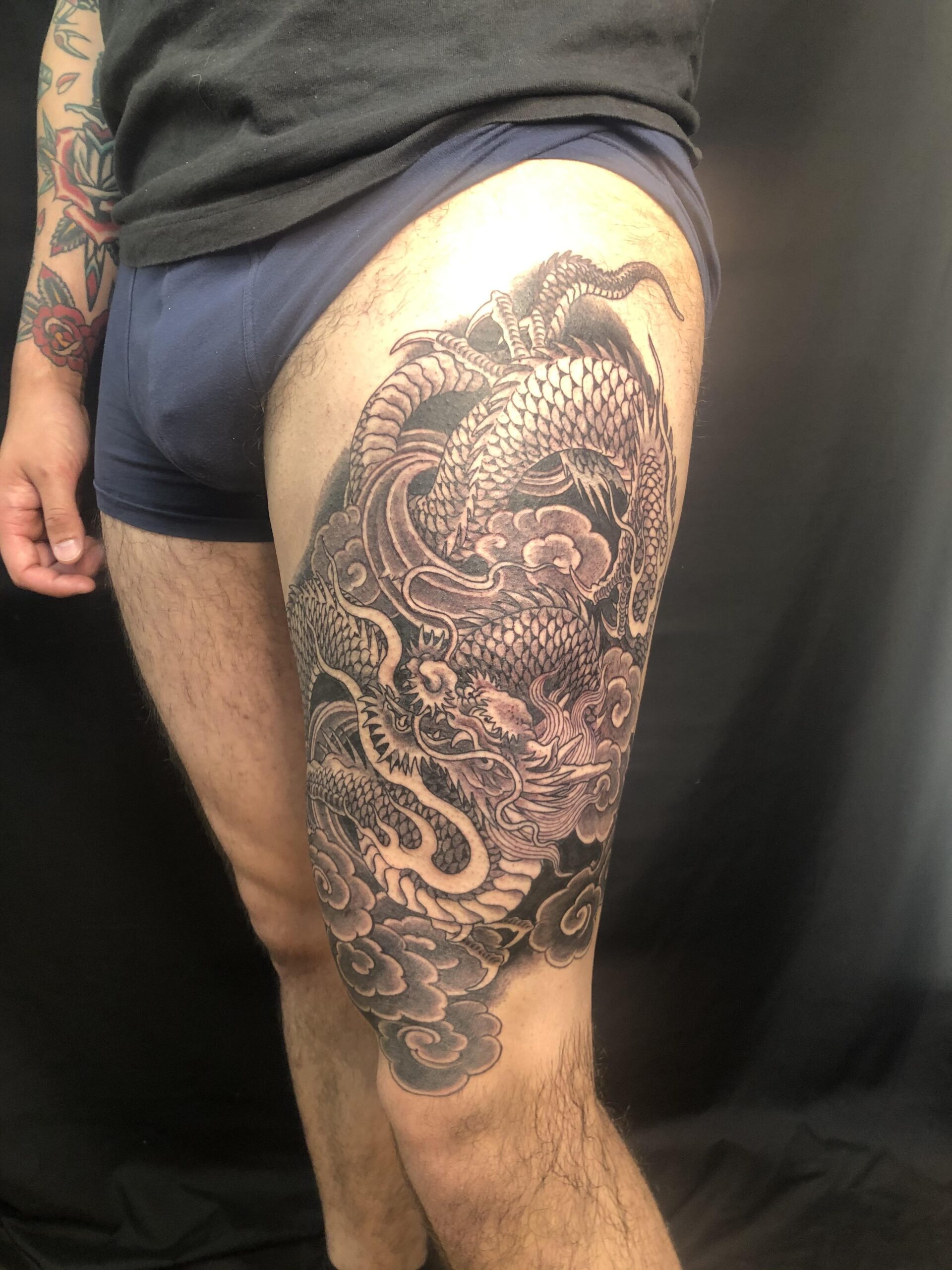 Intricate Thigh Dragon Tattoo Art