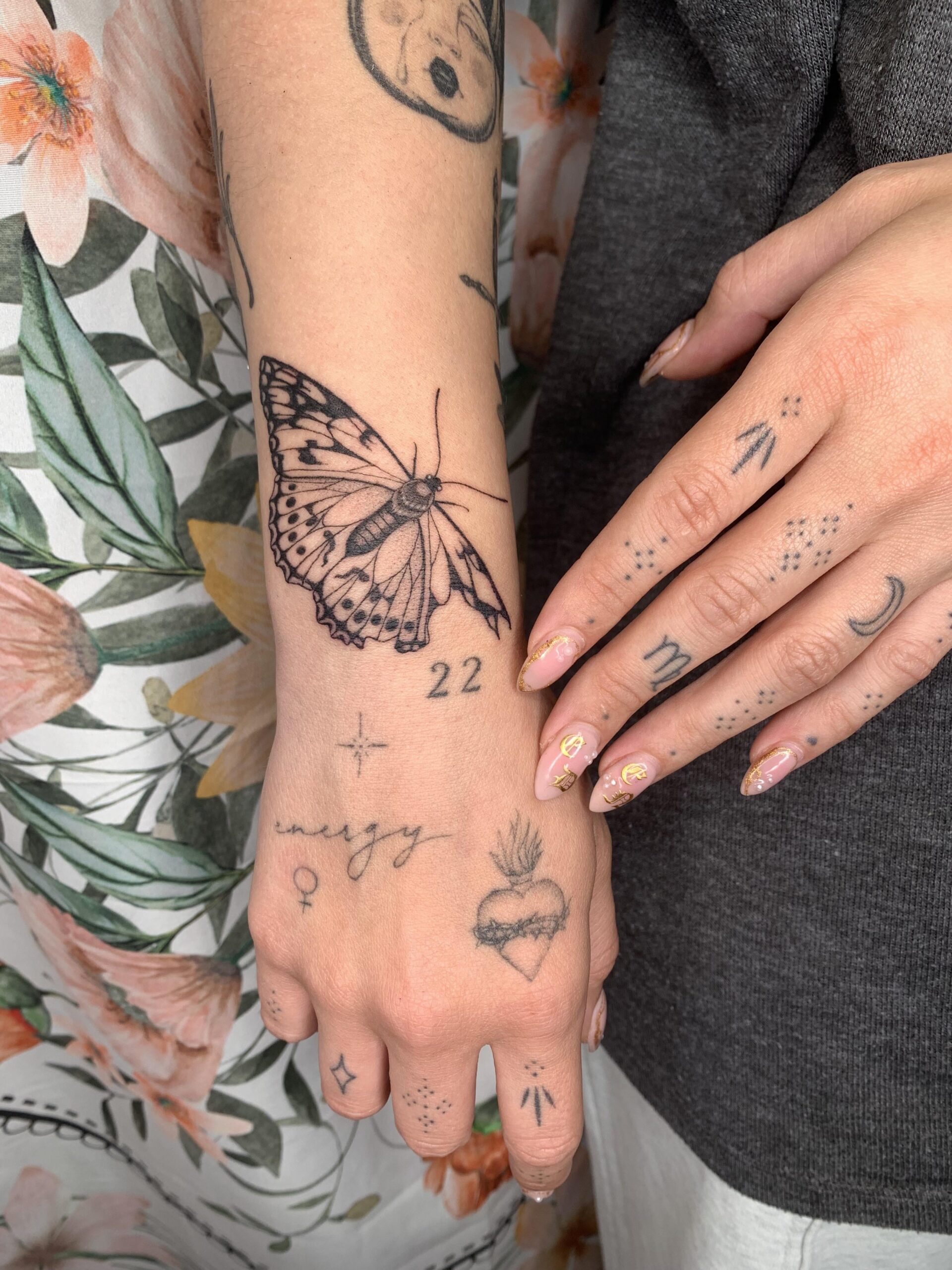 Fine Line Artistic Butterfly Hand Tattoo