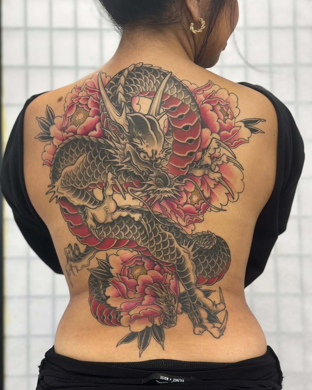 Stunning Floral Dragon Back Tattoo