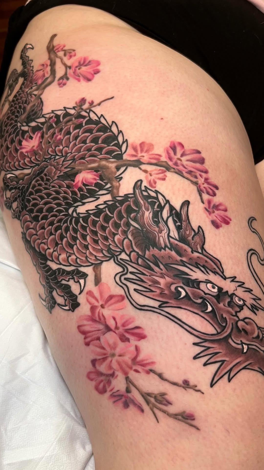 Elegant Dragon and Cherry Blossom Thigh Tattoo