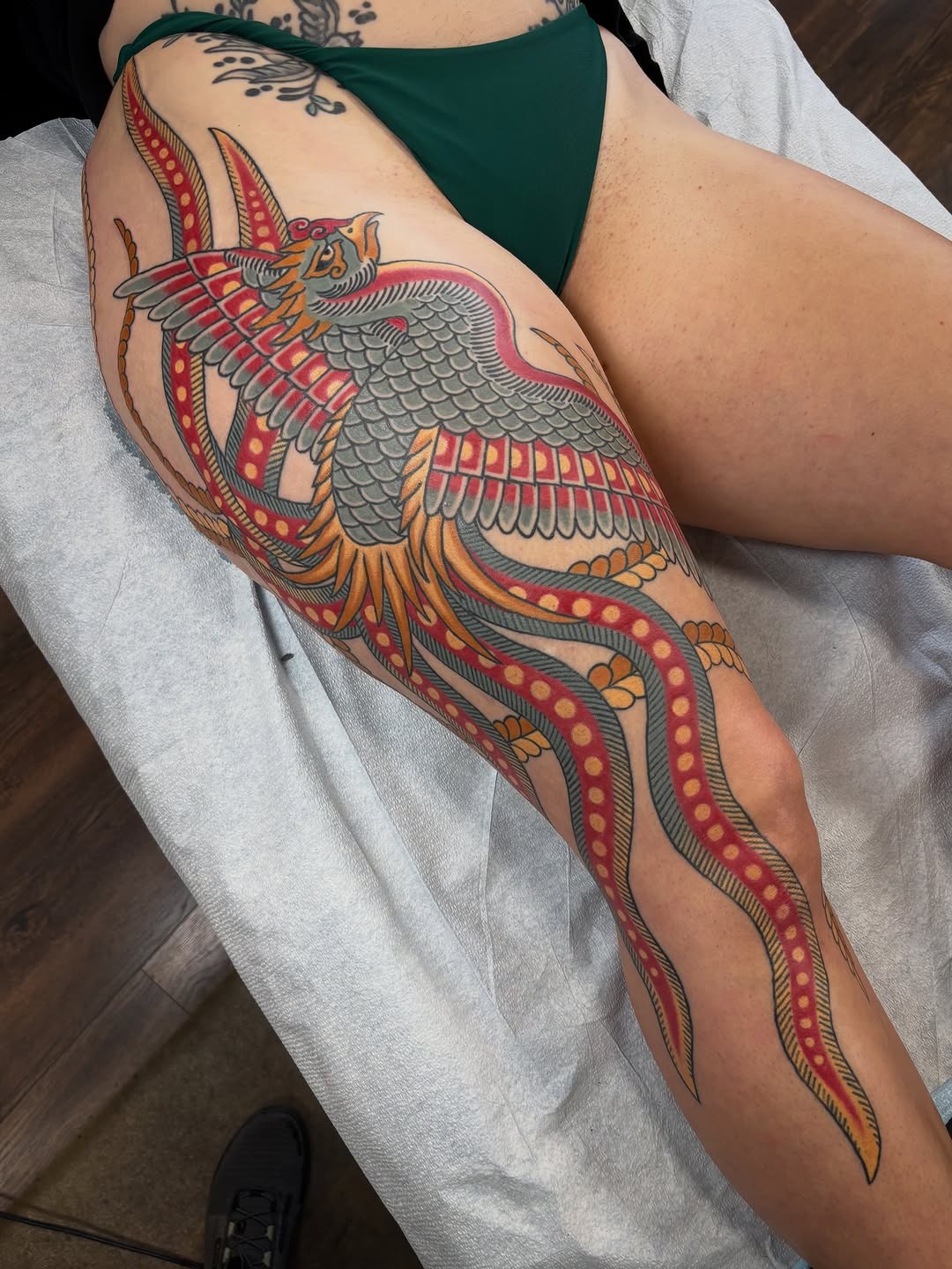 Intricate Mythological Creature Thigh Tattoo
