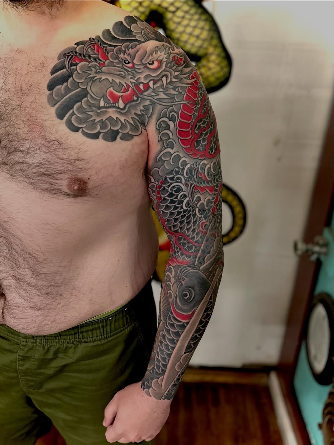 Intricate Dragon Sleeve Tattoo