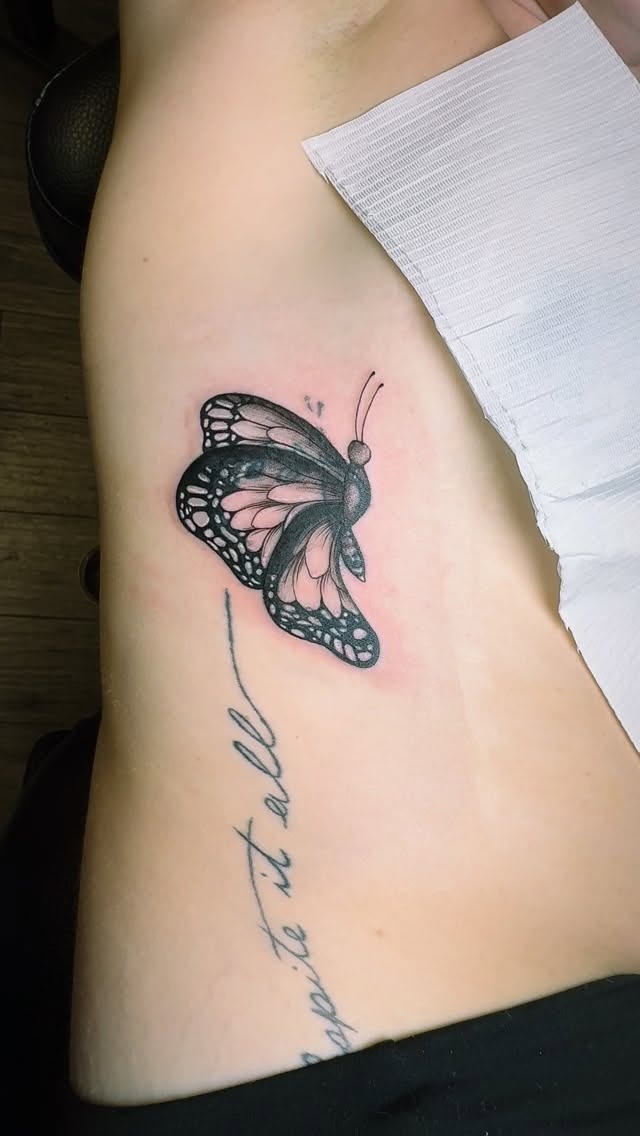 Elegant Rib Cage Butterfly Tattoo