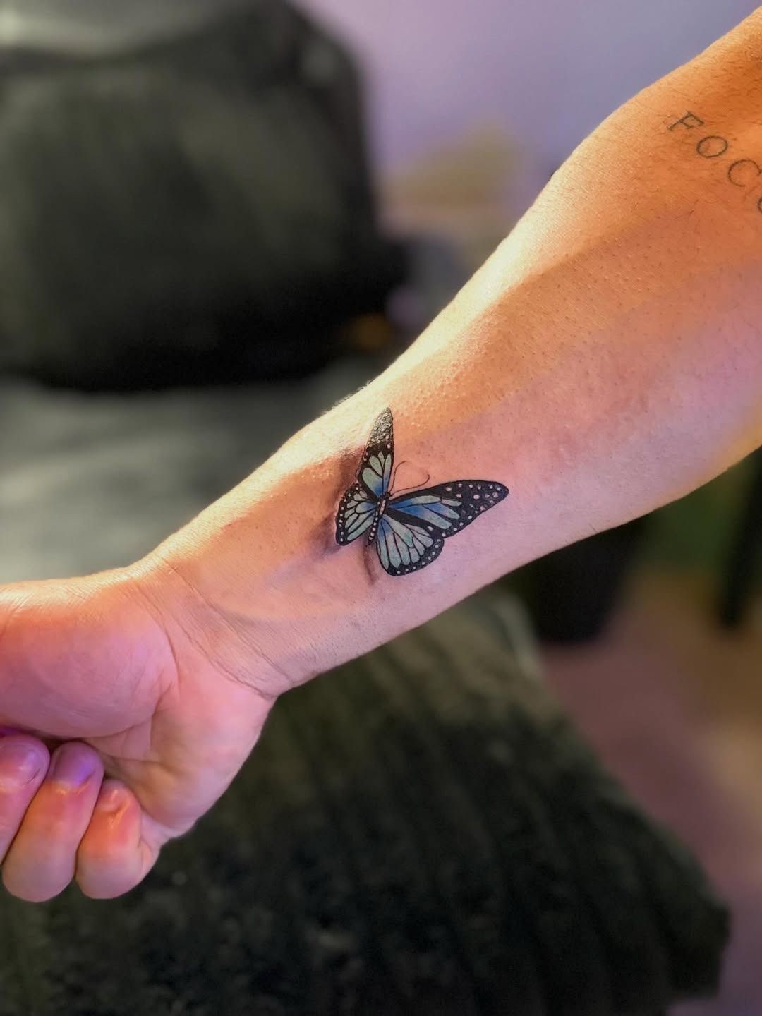 Small Realistic Blue Butterfly Tattoo