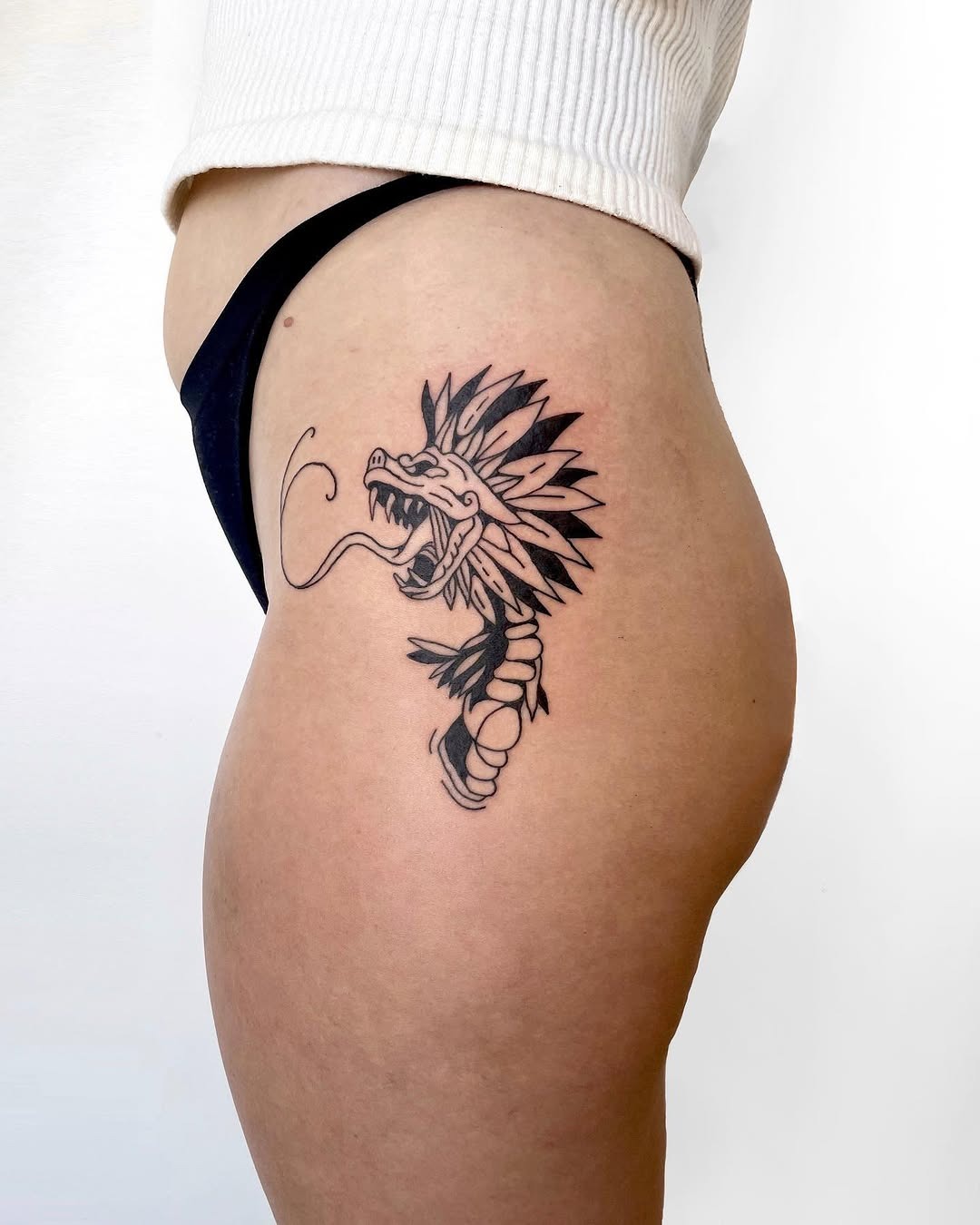 Minimalist Quetzalcoatl Hip Tattoo Concept