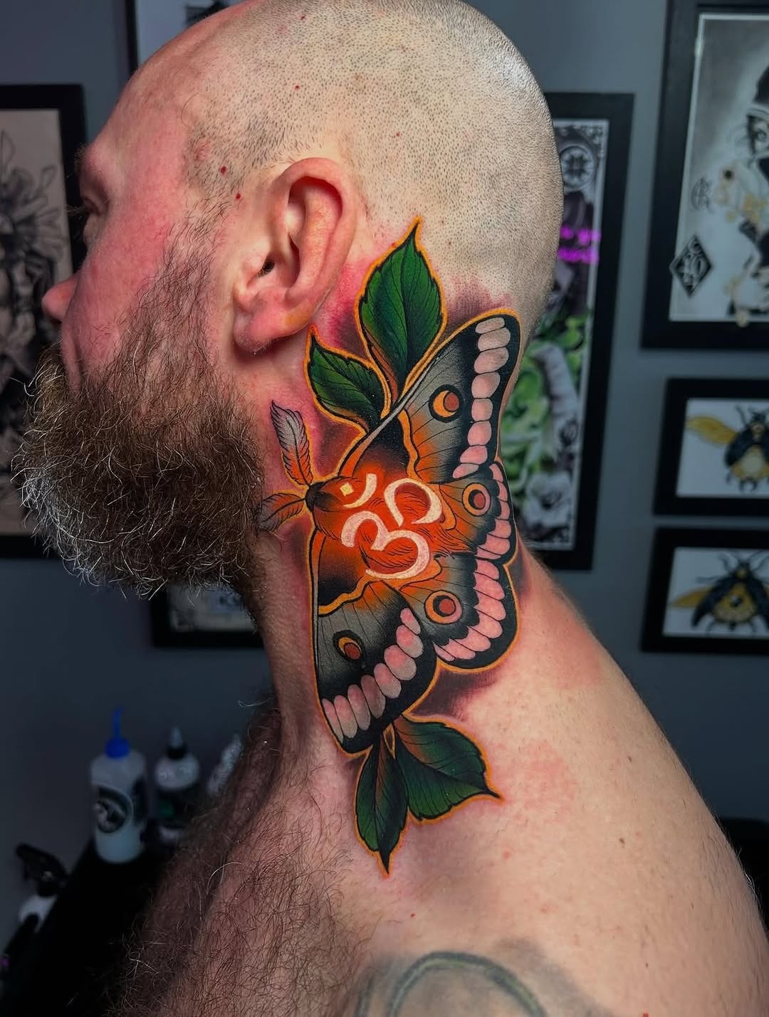 Vibrant Neo-Traditional Moth Neck Tattoo