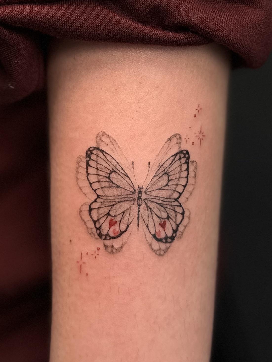 Delicate Fine-Line Butterfly Tattoo