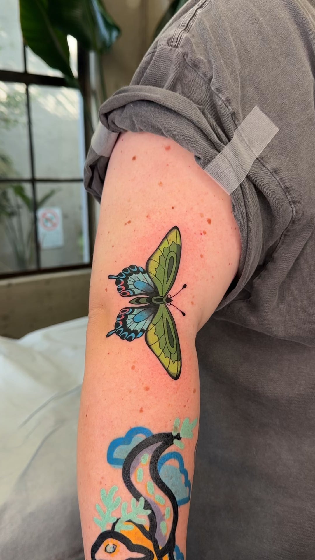 Vibrant Green butterfly Tattoo Detail