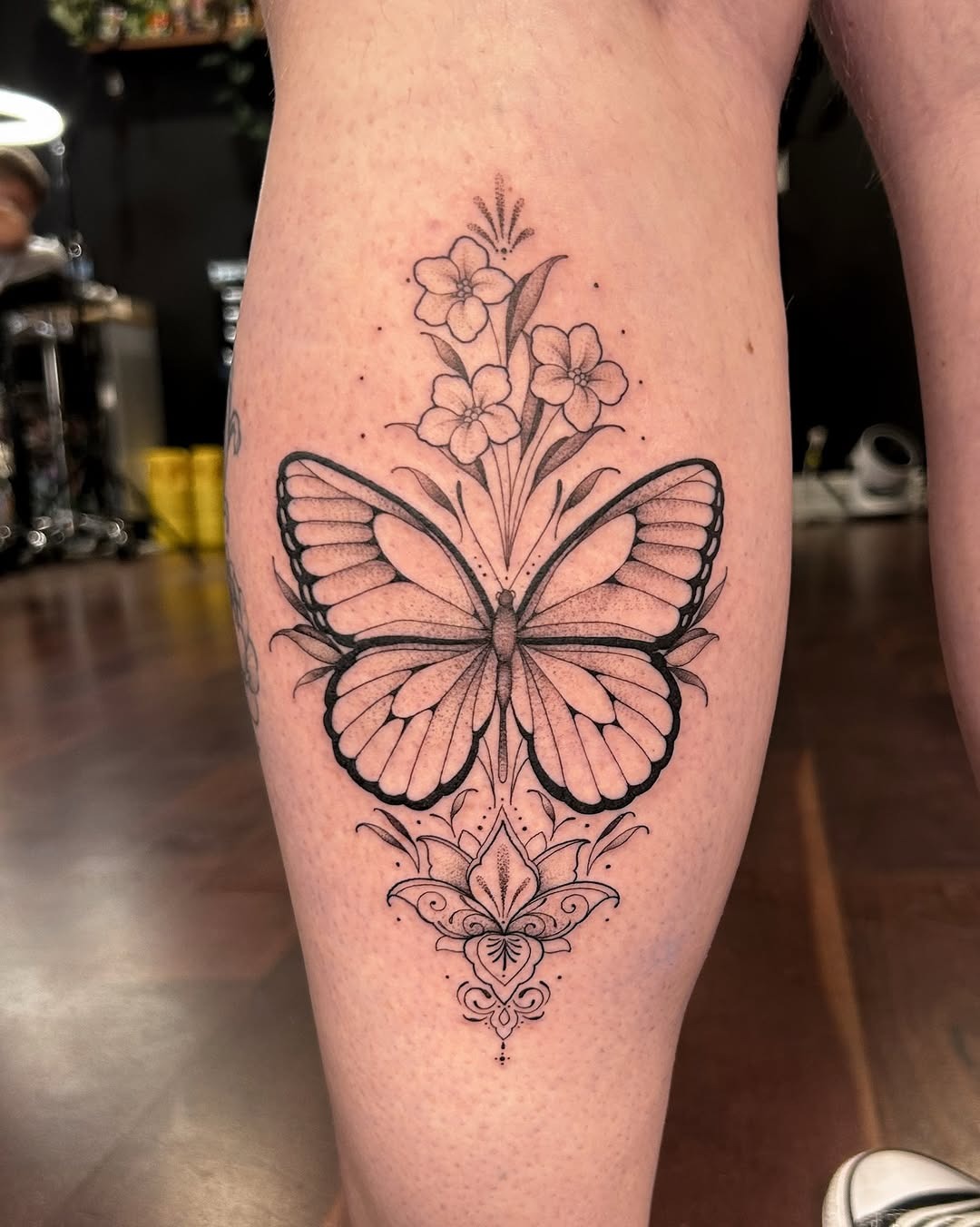 Ornate floral and butterfly leg piece