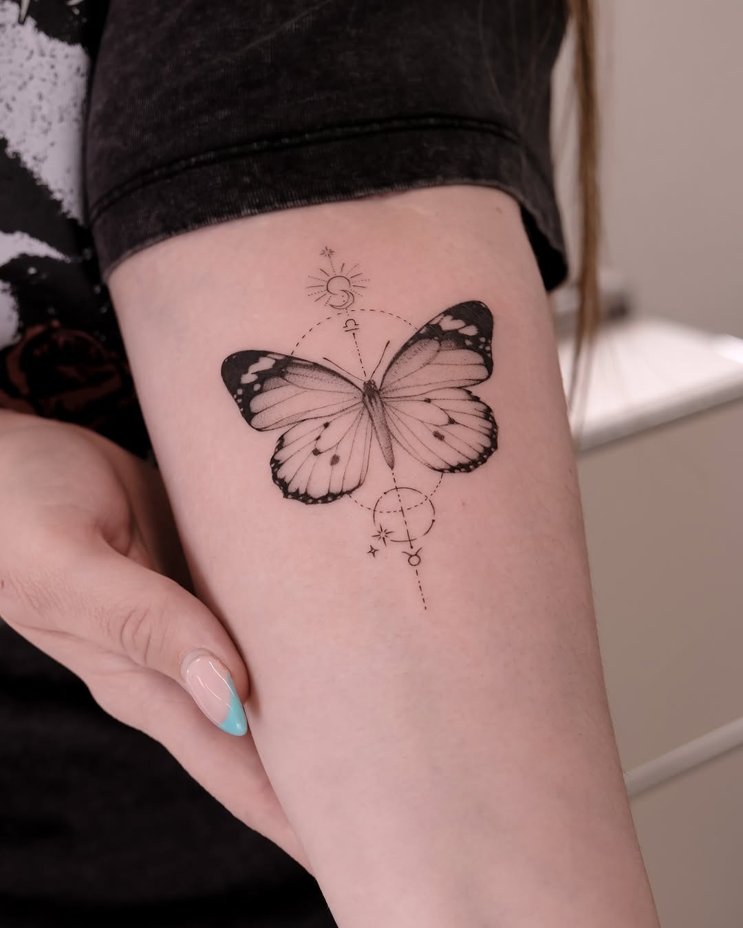 Geometrically Framed Butterfly Tattoo