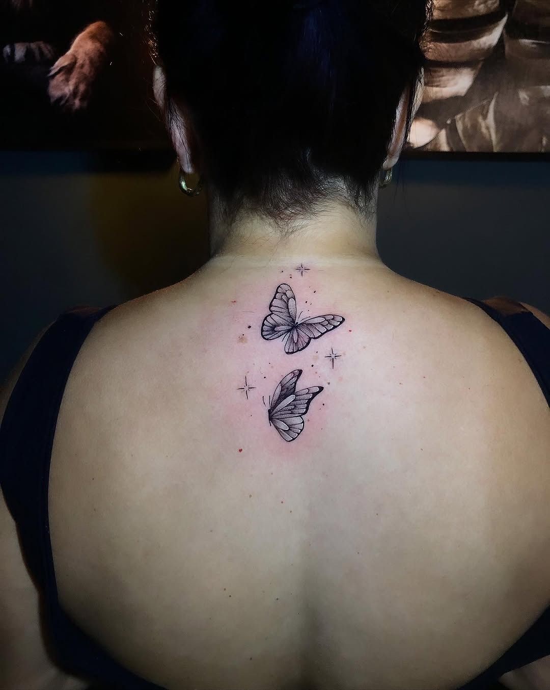 Dainty neck butterfly tattoo