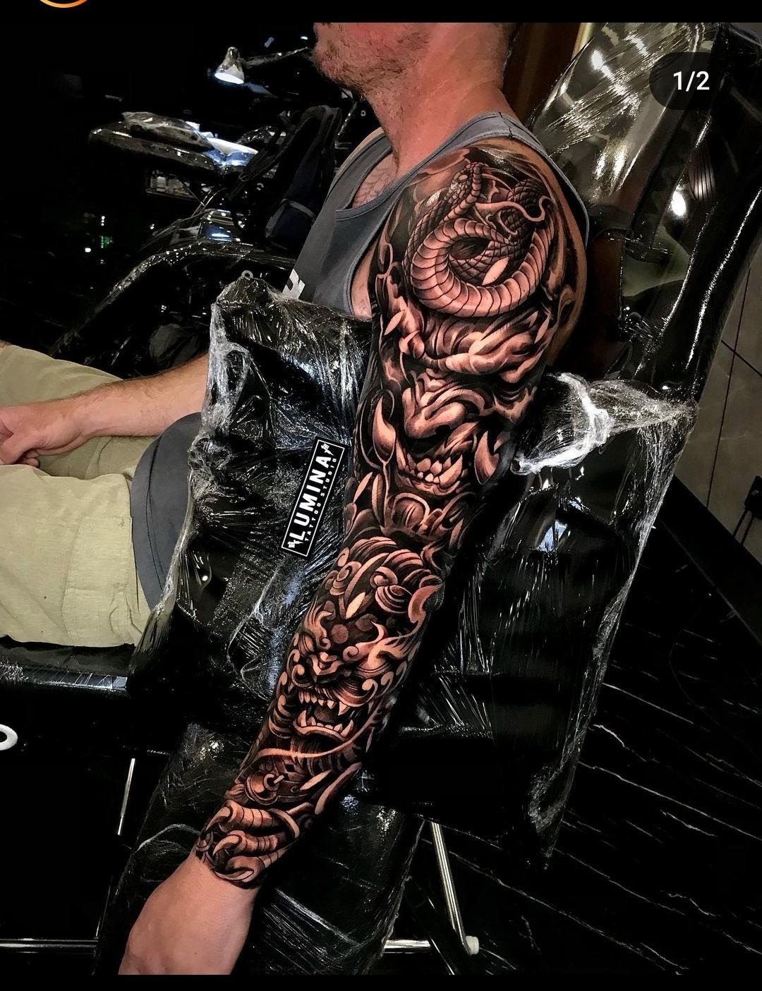 Intricate Oni Mask Sleeve Tattoo