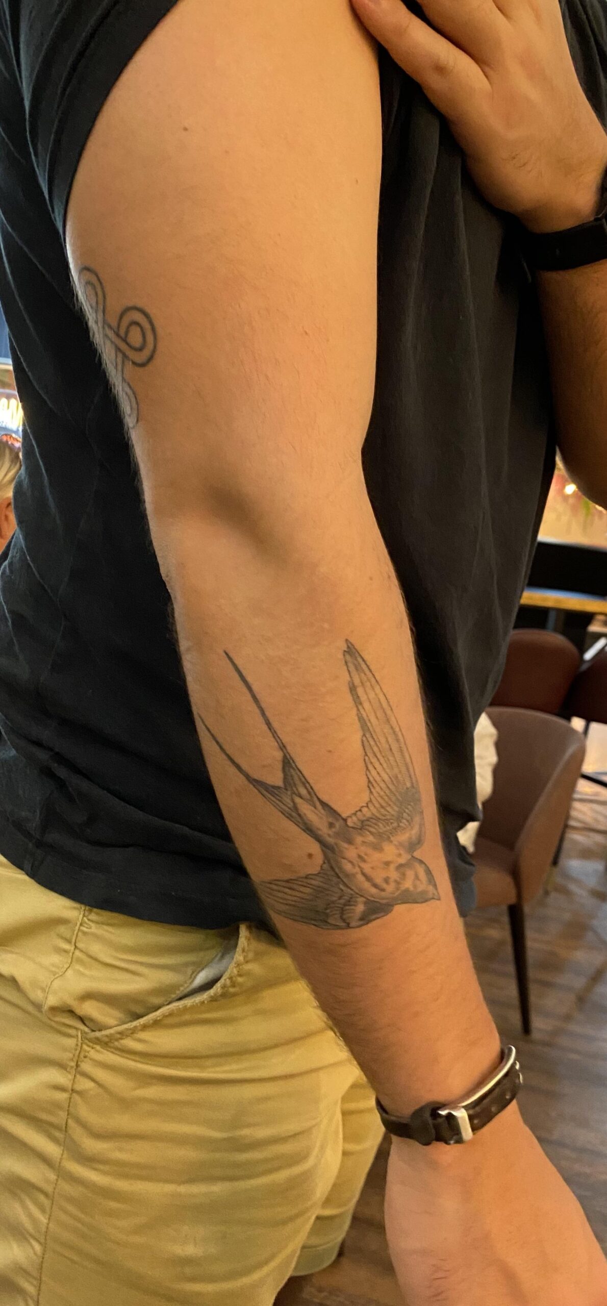 Minimalist Bird Motif Tattoo