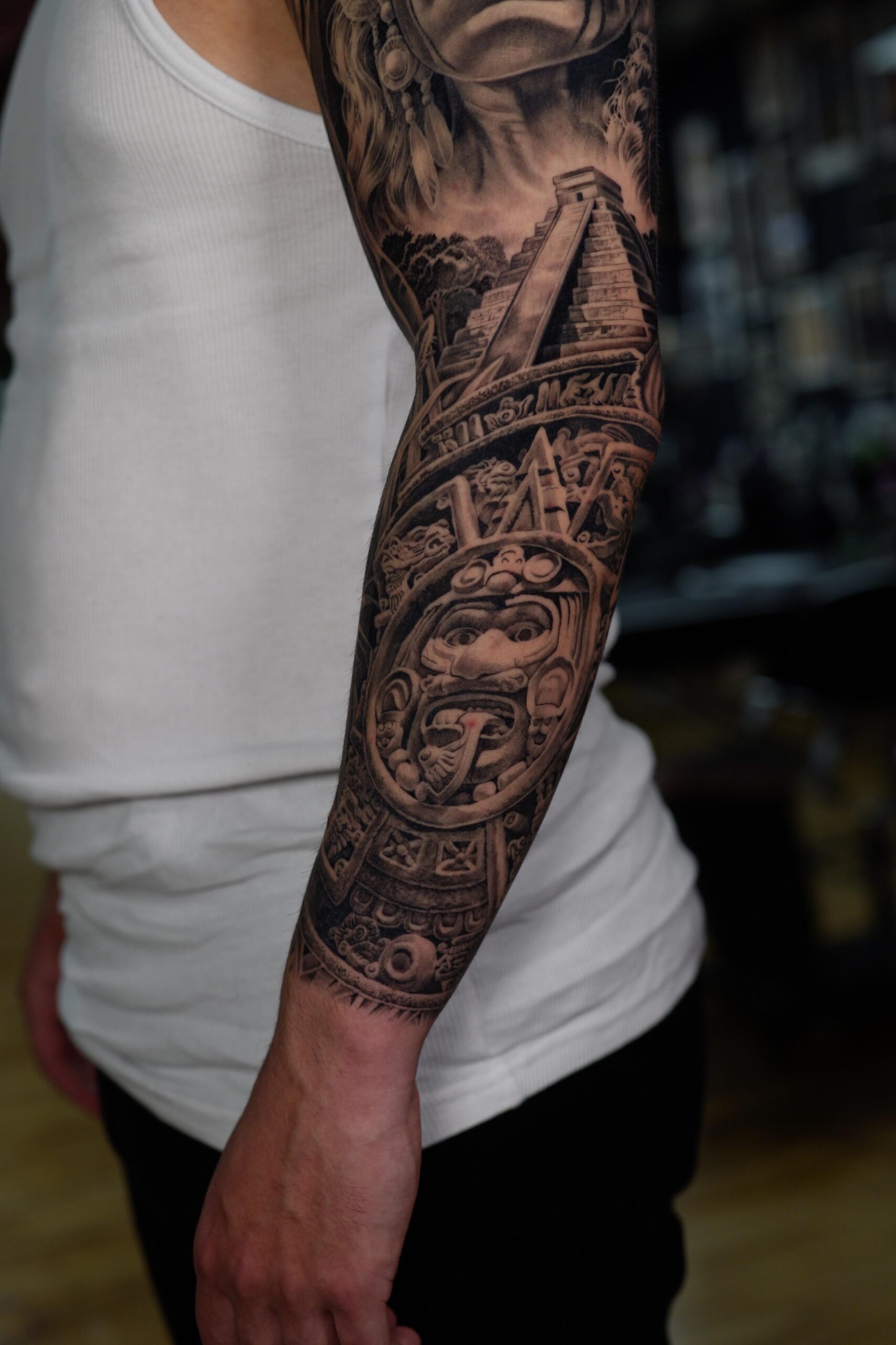 Intricate Aztec sleeve tattoo