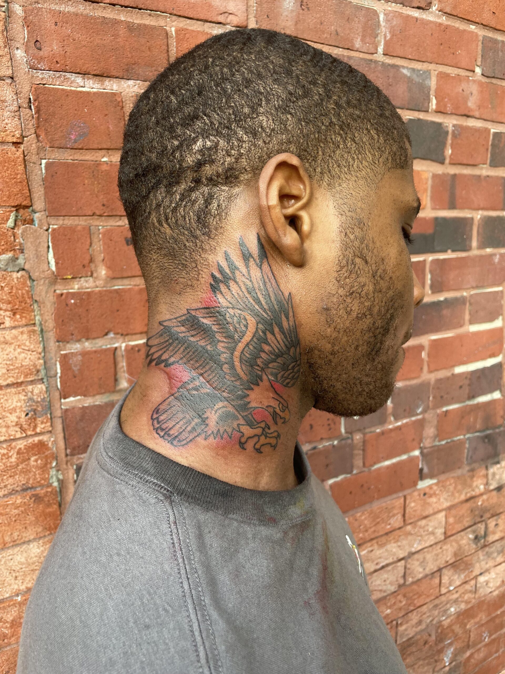 Detailed eagle neck tattoo inspiration