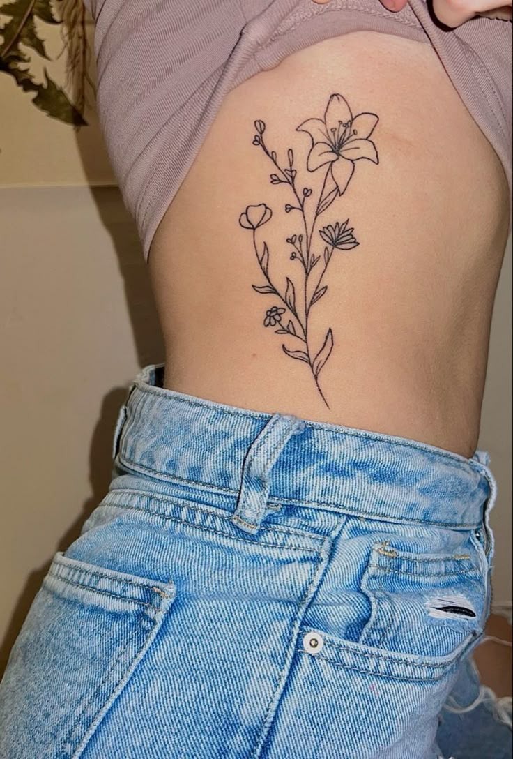 Classic Single-Stem Flower Rib Tattoo