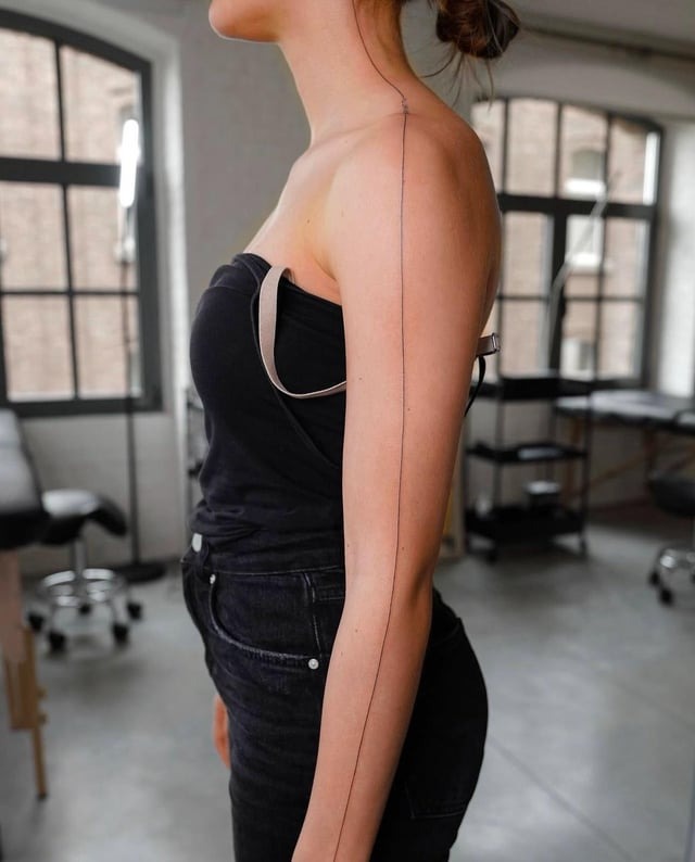 Elegant minimalist straight line tattoo