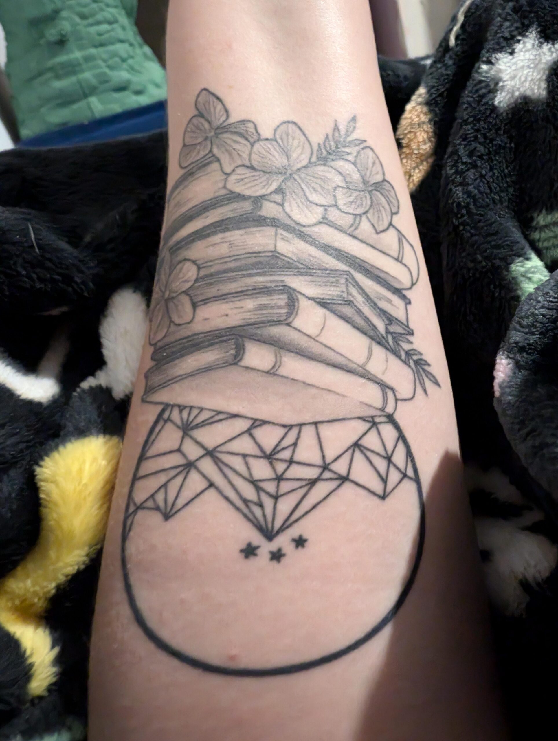 Geometric Book and Flower Tattoo