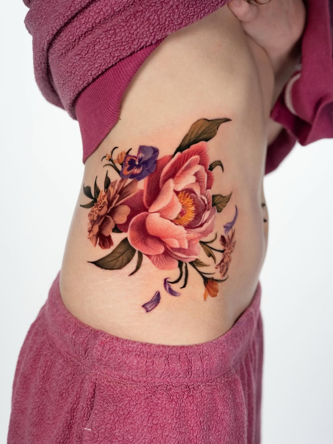 Vibrant Floral Ribcage Tattoo Inspiration