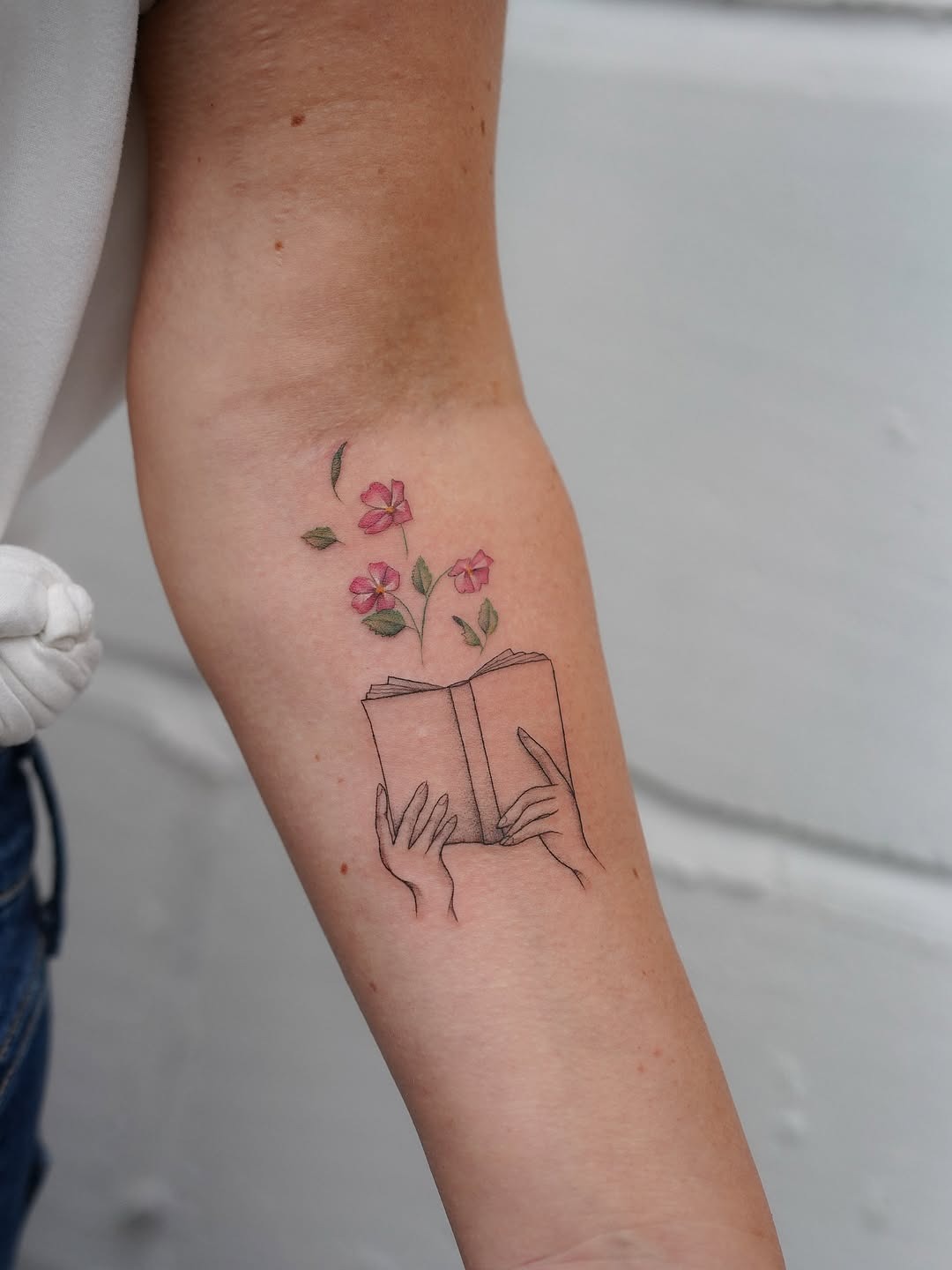 Minimalist Floral Book Tattoo Design