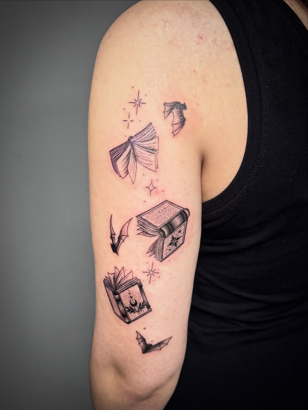 Whimsical Flying Book Tattoo Art