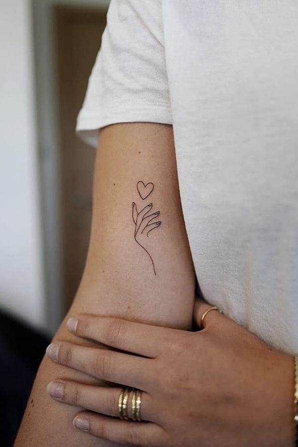 Minimalist 'Heart Hand' Tattoo Art