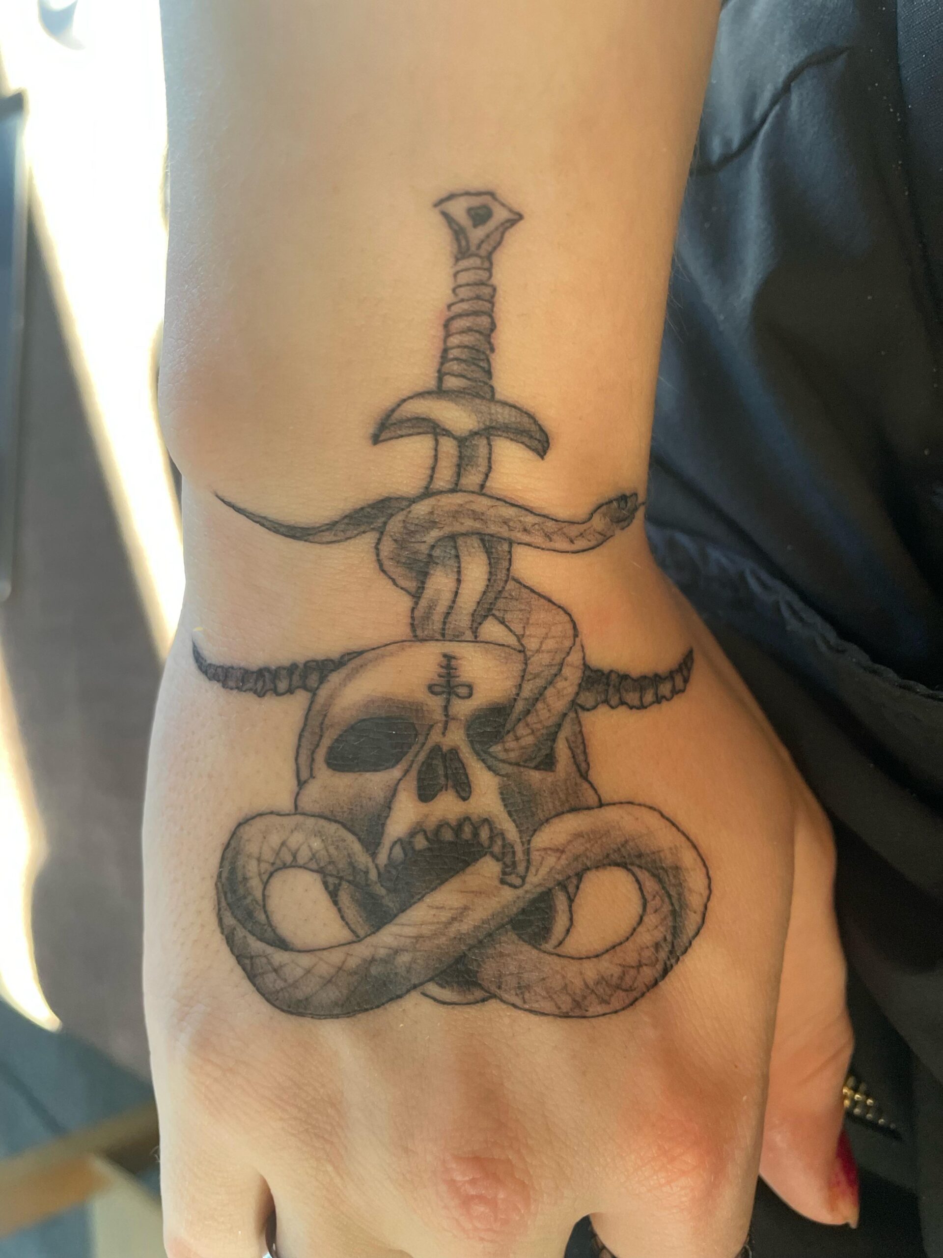 Intricate Gothic Skull and Sword Ink