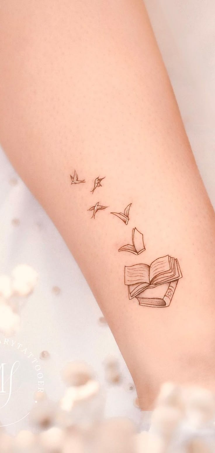 Delicate Book Flying Pages Tattoo