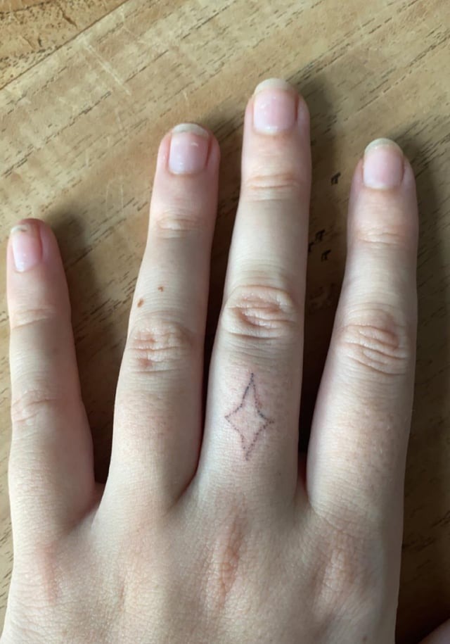 Minimalist Finger Star Tattoo