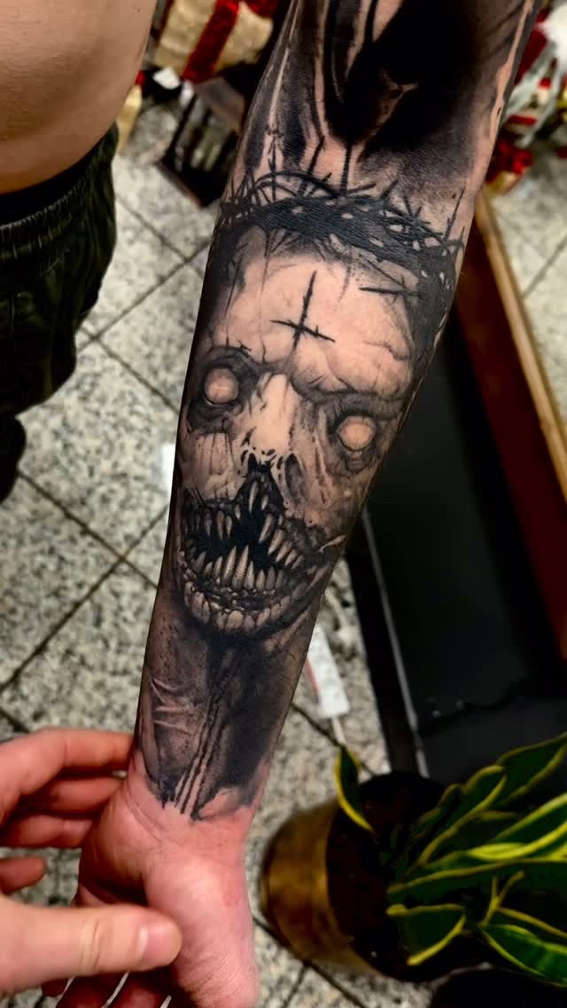 Hauntingly Detailed Forearm Ink Design