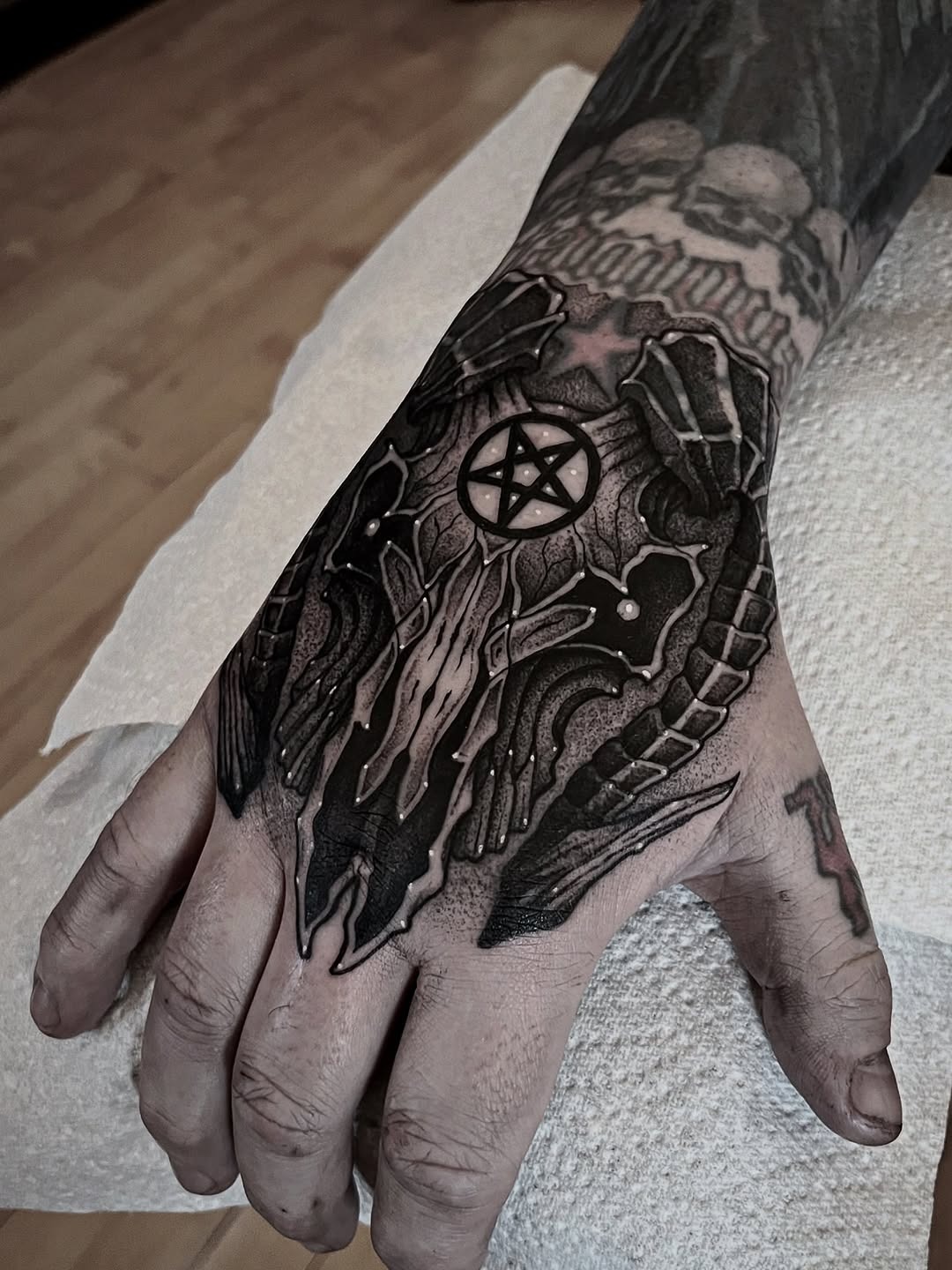 Dark Illustrative Hand Tattoo