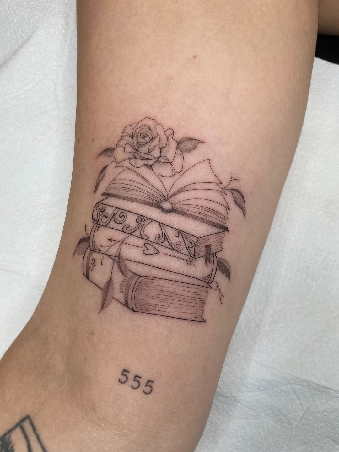 Delicate Book Stack Fine-Line Tattoo Inspiration